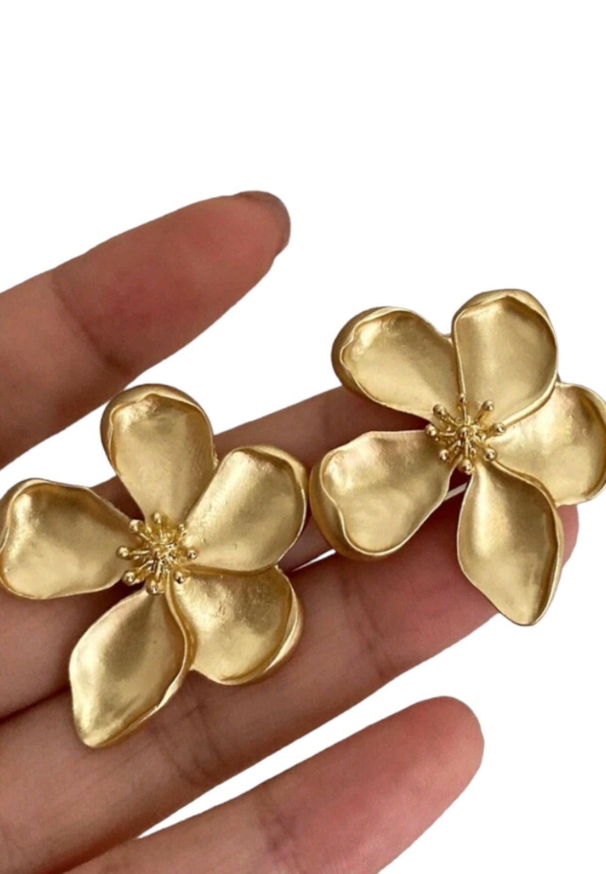 Delicate stud earrings featuring a charming flower design, adding a touch of nature-inspired elegance to your look.