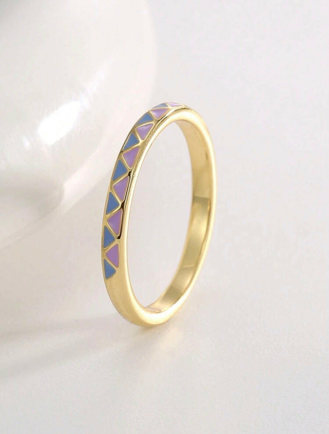 This Grid Pattern and Enamel Decor Ring features a unique design that combines an elegant grid pattern with a bright and colorful enamel finish. Its lightweight and comfortable wearability make it perfect for everyday wear.