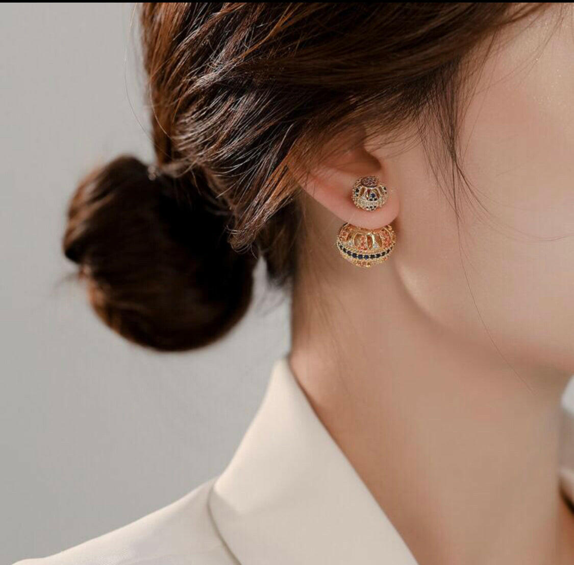 Add a timeless look to your wardrobe with these vintage-style earrings. Crafted with a hollow out ball and cubic zirconia decor, these stud earrings add sparkle with an elegant style.