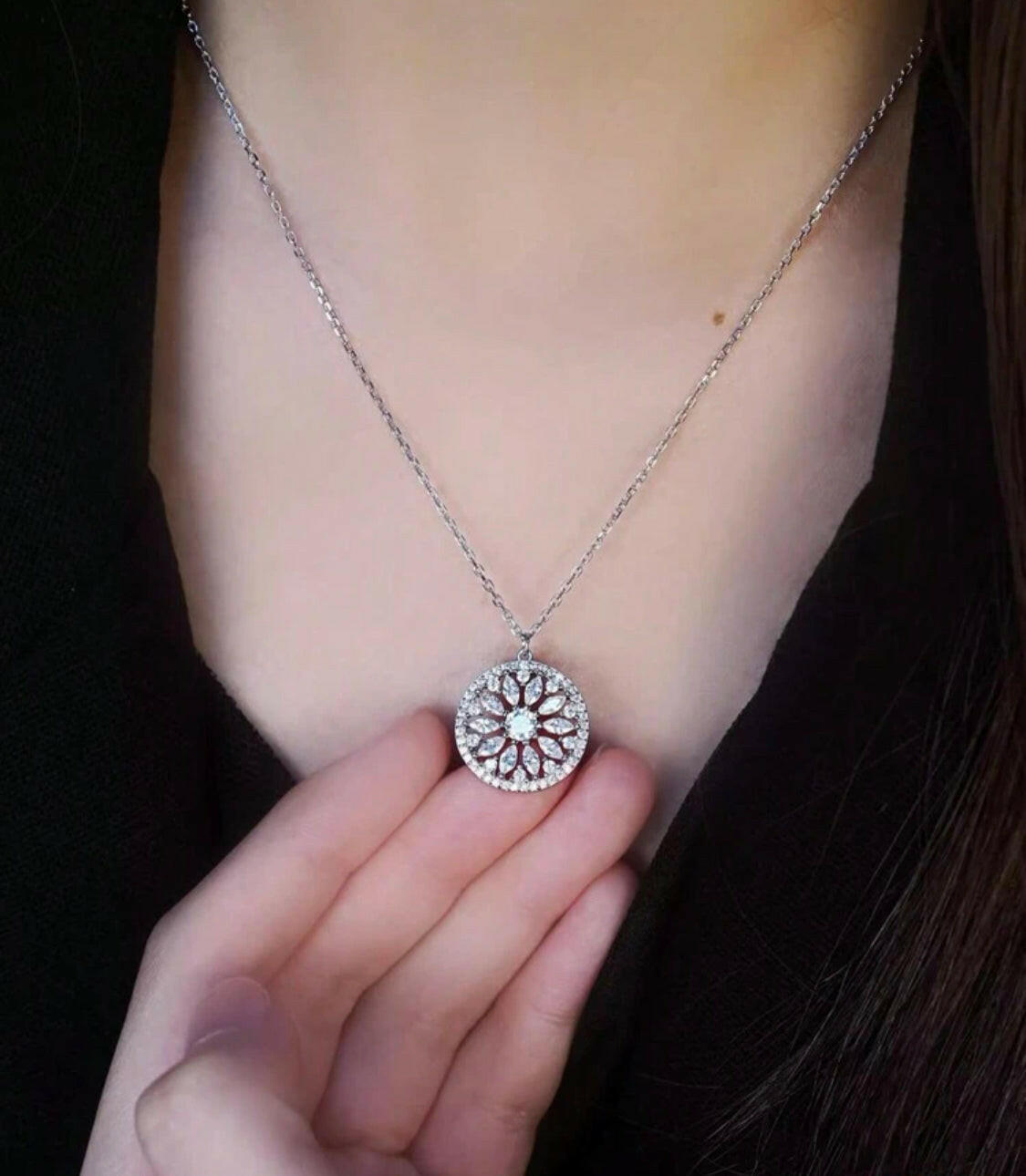 This stylish pendant necklace is crafted from gold-plated sterling silver and inlaid with sparkling cubic zirconia stones. The eye-catching sunflower design brings a hint of nature to your outfit. A perfect accessory for any special occasion.