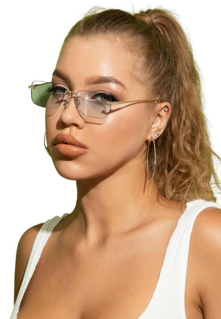 Square Rimless Sunglasses with a sleek and minimalist design. These sunglasses feature square-shaped lenses held by a rimless frame, offering a chic and lightweight option for sun protection and style.