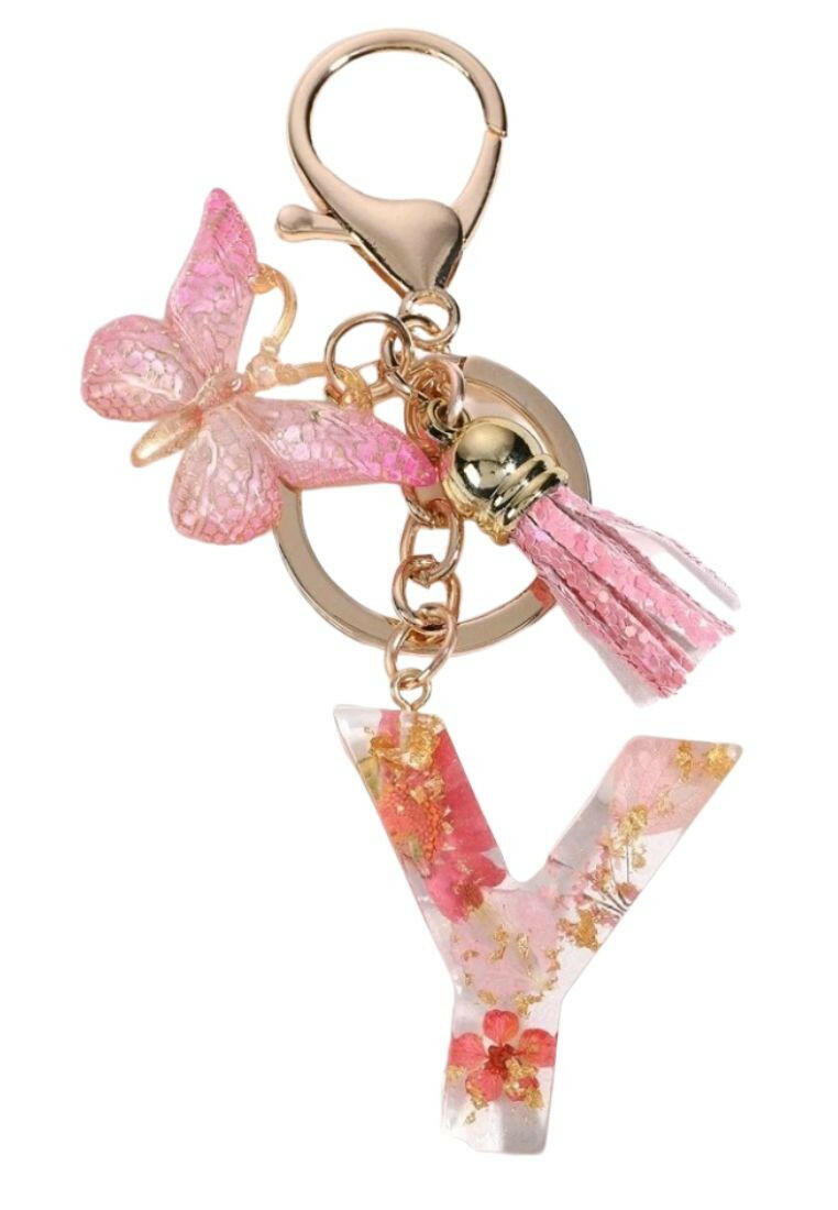 this Pink Butterfly & Tassel Decor Fashionable Keychain, you can do just that! This charming keychain features a delicate butterfly design and is perfect for adding a touch of elegance to any set of keys.