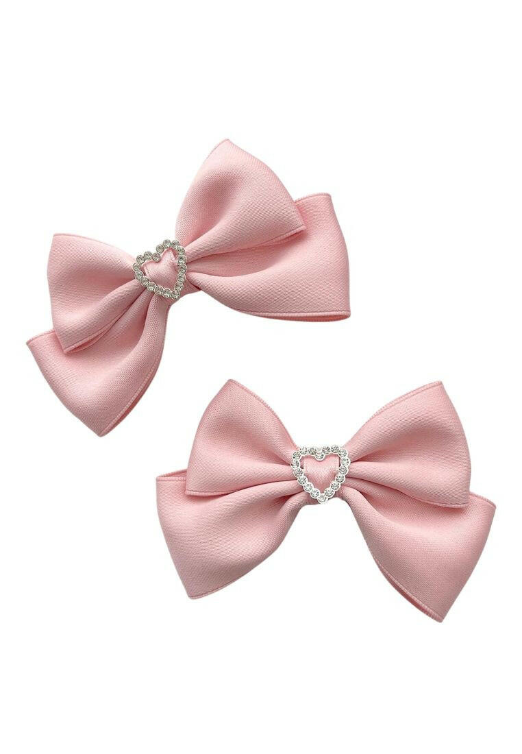 Two alligator hair clips featuring rhinestone heart and bow decorations, combining charm and sparkle for a delightful addition to your hairstyle.