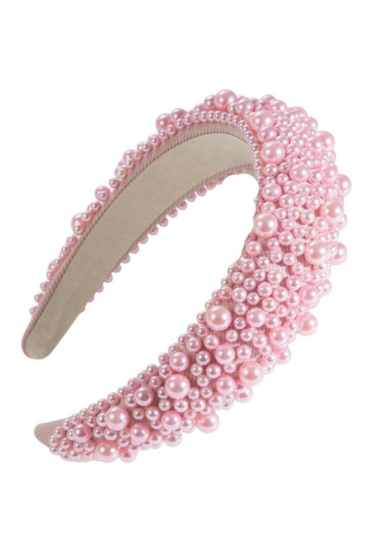 Wide headband adorned with faux pink pearls, offering a blend of style and sophistication, perfect for enhancing your hair ensemble.