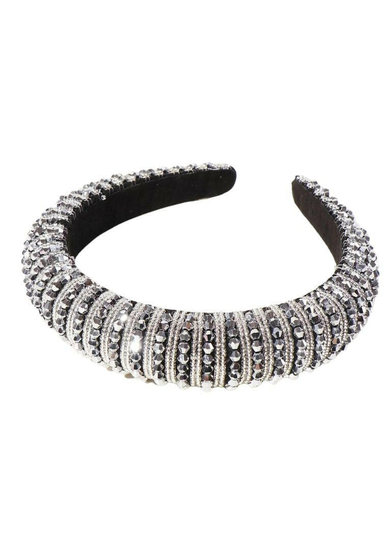 A hair hoop embellished with beads, creating a stylish and eye-catching accessory for your hair.