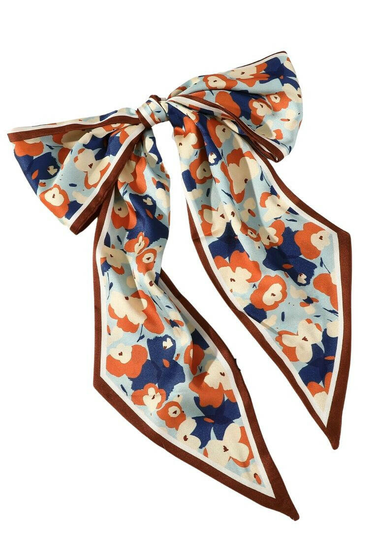 Hair band featuring a floral pattern, adding a touch of nature-inspired charm to your hairstyle.