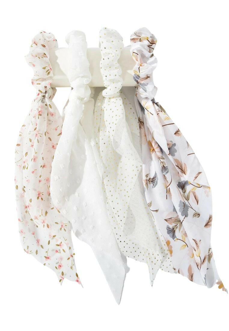 A set of four hair ties featuring floral print designs, adding a touch of nature-inspired charm to your hair accessories.