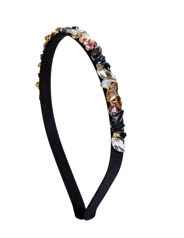 A sleek black headband embellished with shimmering cubic zirconia, adding a touch of elegance and sophistication to your hairstyle.