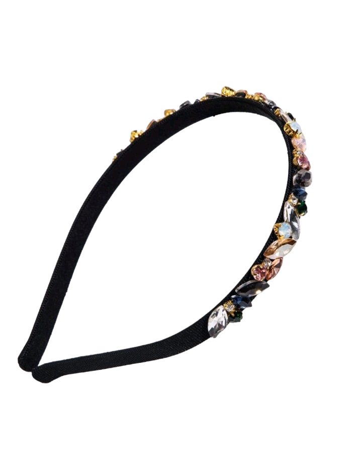A sleek black headband embellished with shimmering cubic zirconia, adding a touch of elegance and sophistication to your hairstyle.