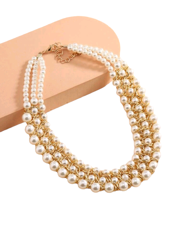 Image of a faux pearl beaded layered necklace, featuring multiple strands of lustrous pearl-like beads elegantly arranged, creating a sophisticated and timeless accessory for any outfit or occasion.