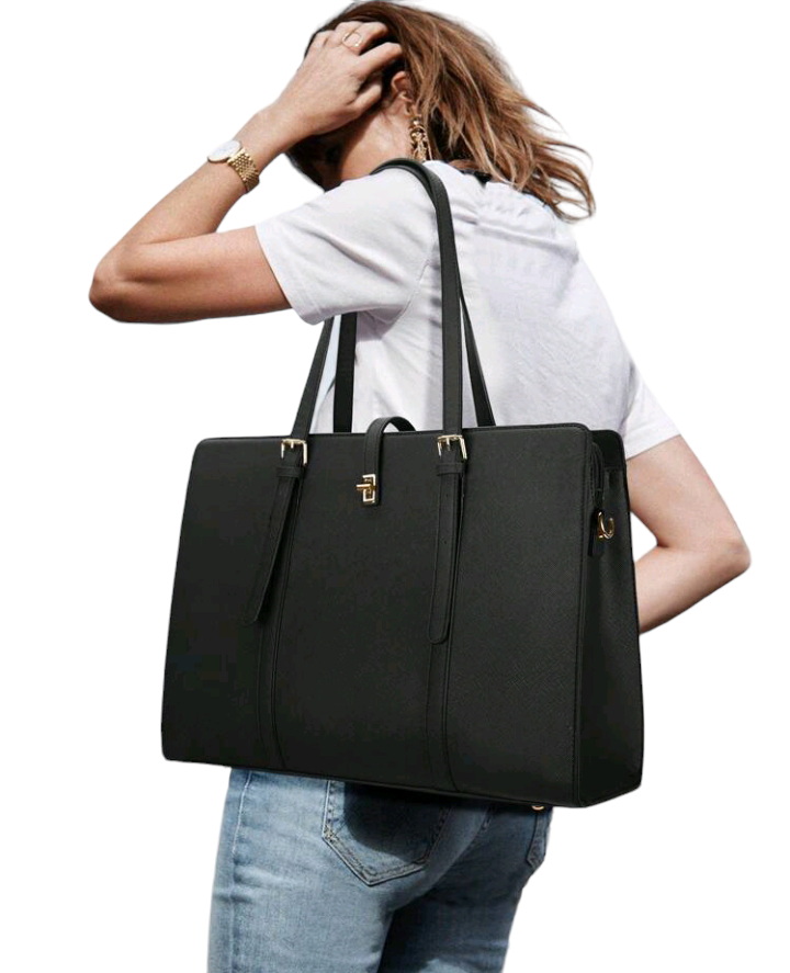 A black minimalist tote bag with a spacious interior, designed for maximum functionality. This sleek and versatile bag combines style and practicality, making it an ideal accessory for carrying your essentials with understated elegance.