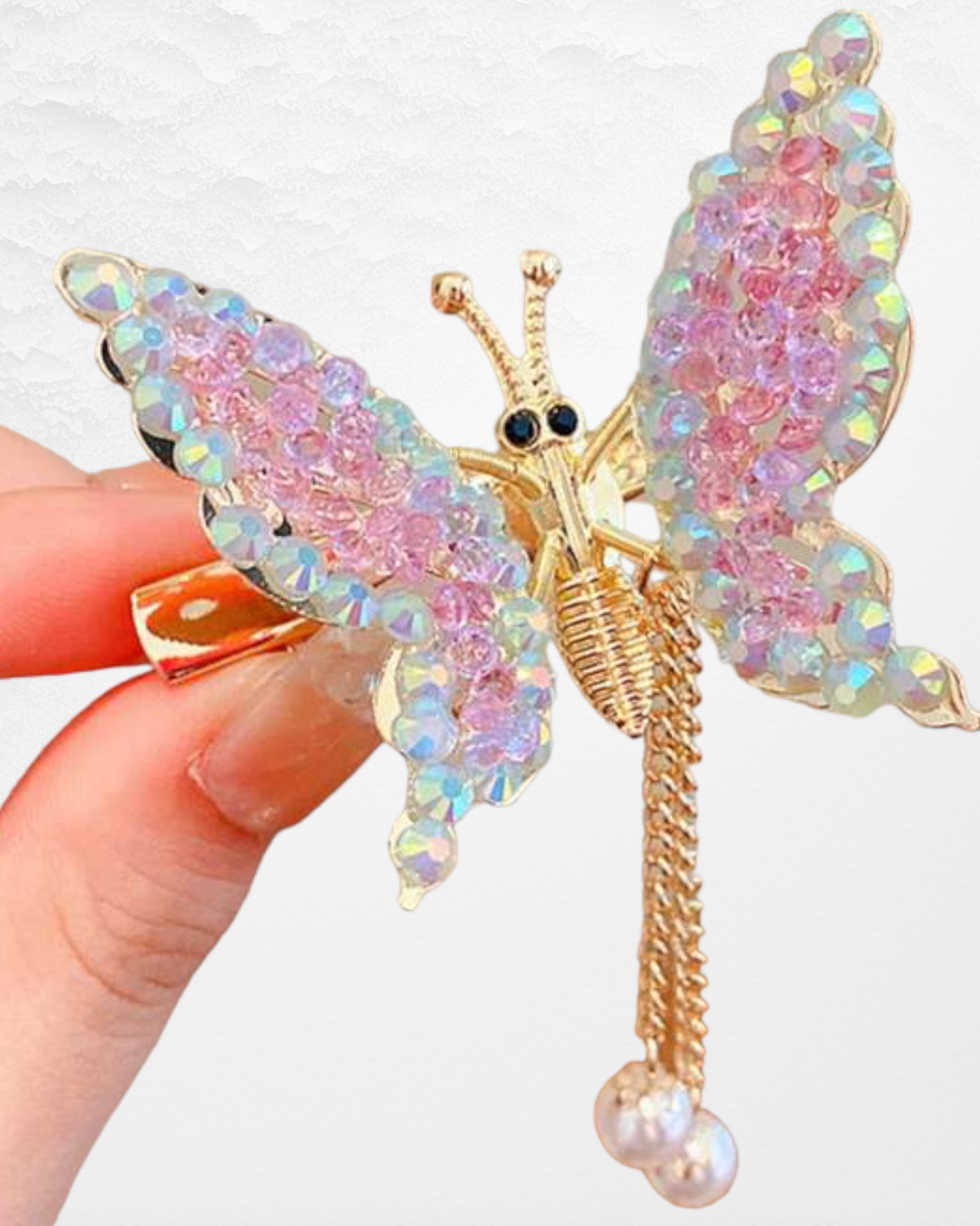 An alligator hair clip adorned with butterfly decorations and faux pearl charms, creating a fashionable and charming accessory for your hair.