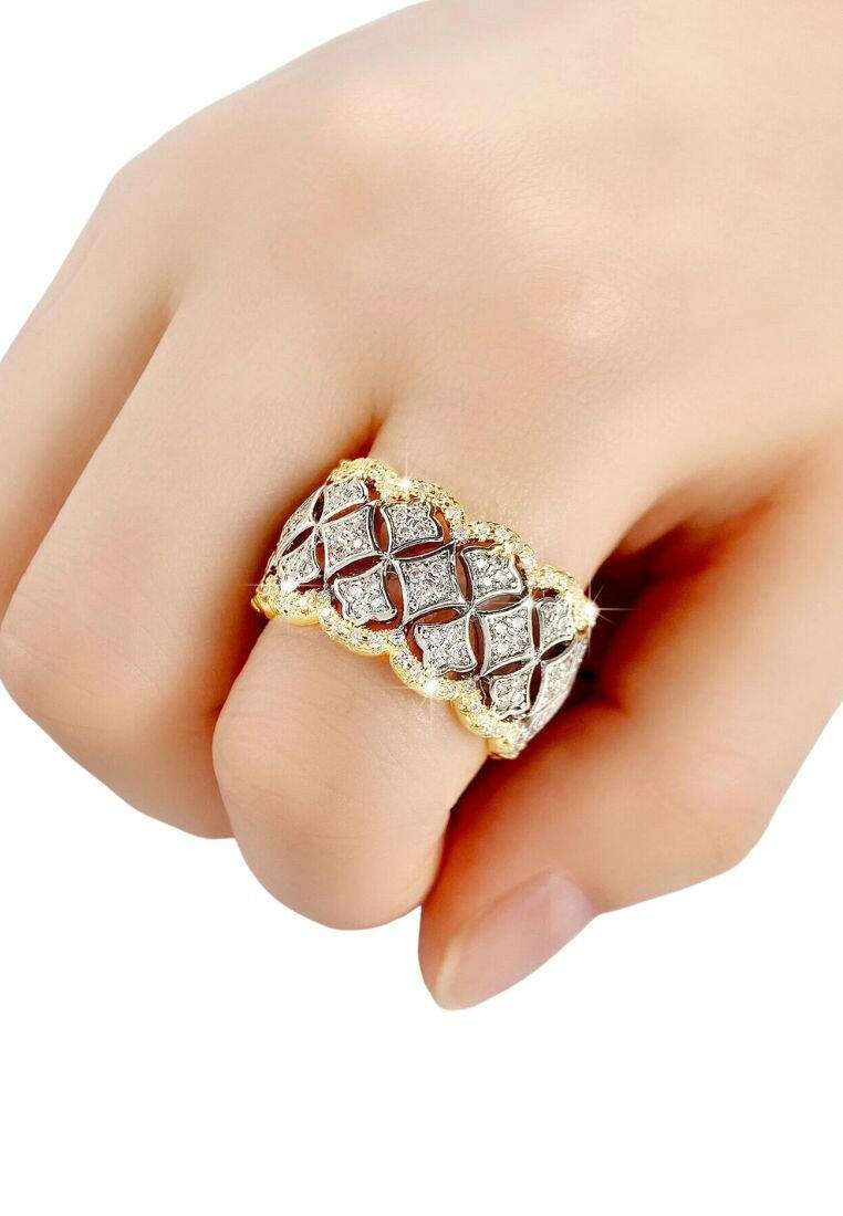 A stunning cubic zirconia decor ring with intricate details. The ring showcases a brilliant cubic zirconia gemstone set in an elegantly designed setting. The shimmering gemstone creates a captivating and glamorous look. This ring is a stylish and sophisticated accessory that adds a touch of elegance and luxury to any outfit.