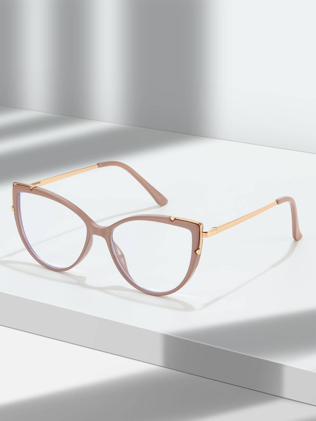 These Dusty Pink Cat Eye Anti-Blue Light Eyeglasses protect your eyes from the harm caused by blue-light emissions, such as digital eye strain, headaches, and blurry vision. The stylish cat-eye frame adds an extra touch of sophistication to your look.