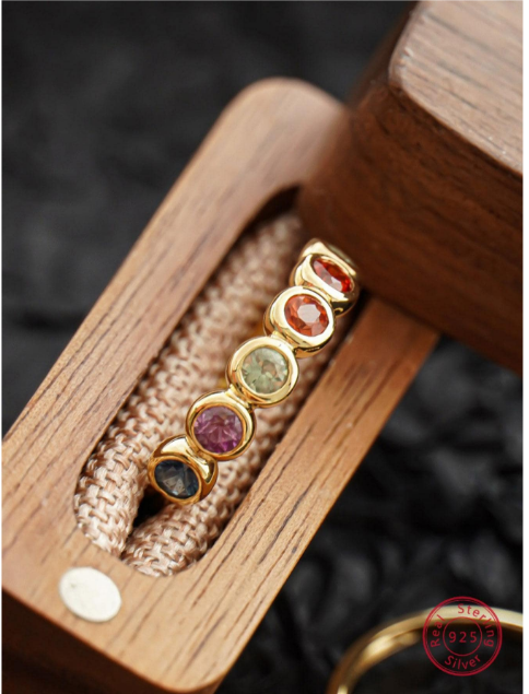 A glamorous sterling silver ring adorned with cubic zirconia gems. The ring features sparkling cubic zirconia stones set within an intricately designed sterling silver setting. The combination of the shimmering gemstones and the lustrous silver creates a captivating and elegant look. This ring is a stylish and sophisticated accessory that adds a touch of opulence and luxury to any outfit.