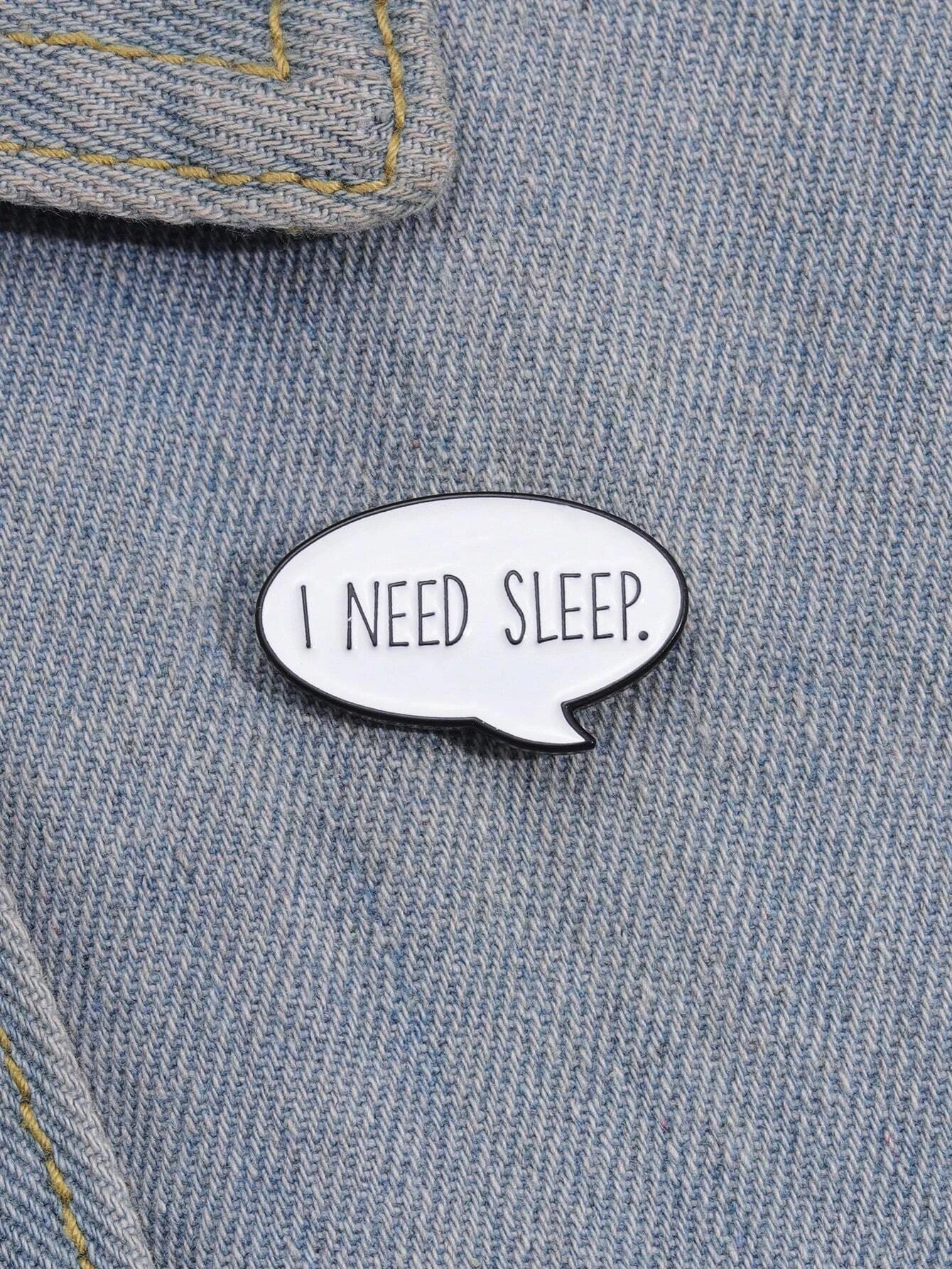 Brooch featuring a "I need sleep" letter graphic design, adding a touch of humor and relatability to your ensemble.
