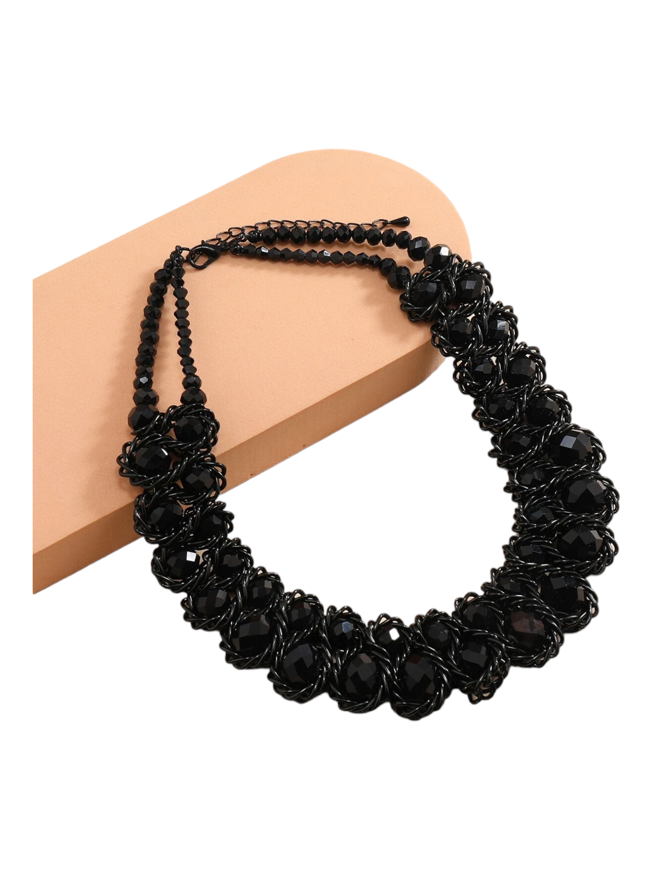 A layered necklace featuring multiple beads and chains arranged in a fashionable manner. The necklace showcases different layers of beads and chains, creating a stylish and textured look. This accessory is versatile and can complement various outfits, adding a touch of trendy elegance.