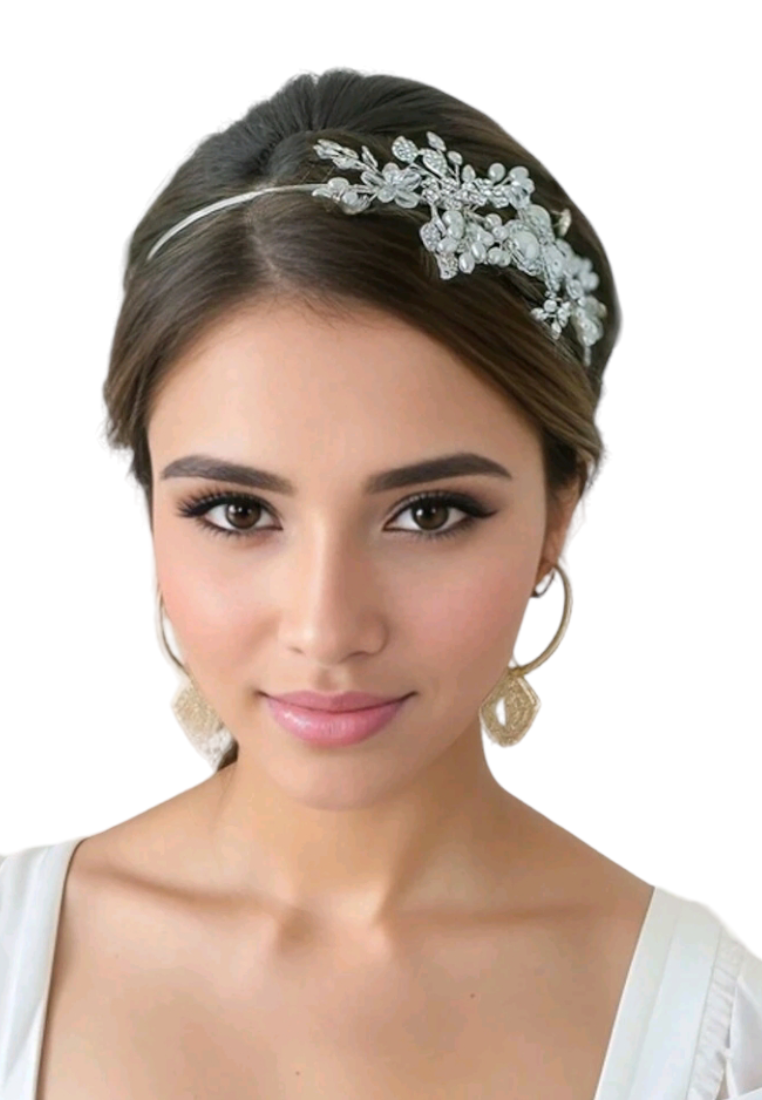 An elegant bridal headband adorned with faux pearls and delicate decorative elements. The headband features a graceful arrangement of lustrous faux pearls, creating a timeless and sophisticated look for brides on their special day.