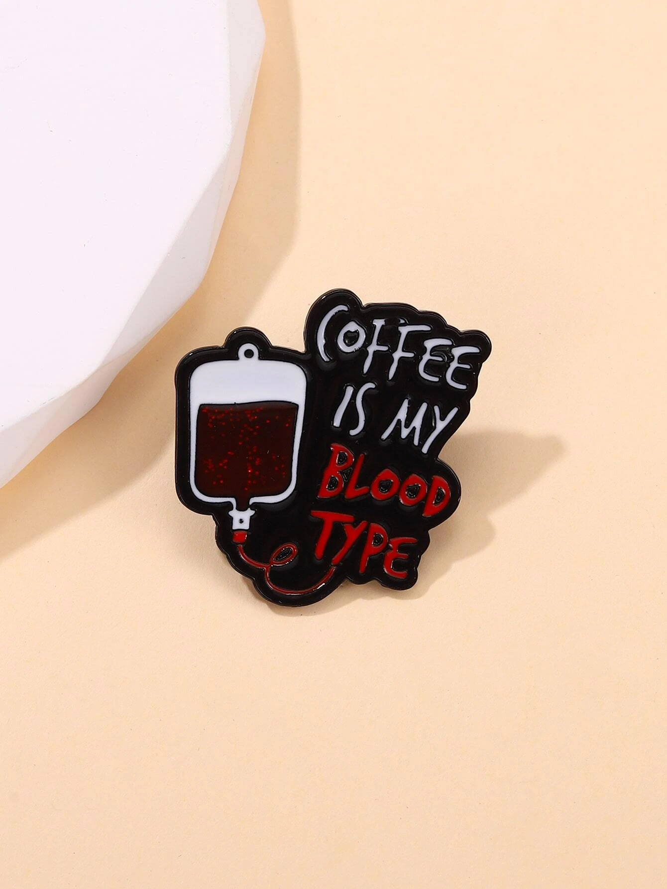 Brooch with intricate slogan detailing, adding a touch of meaningful expression and style to your attire.