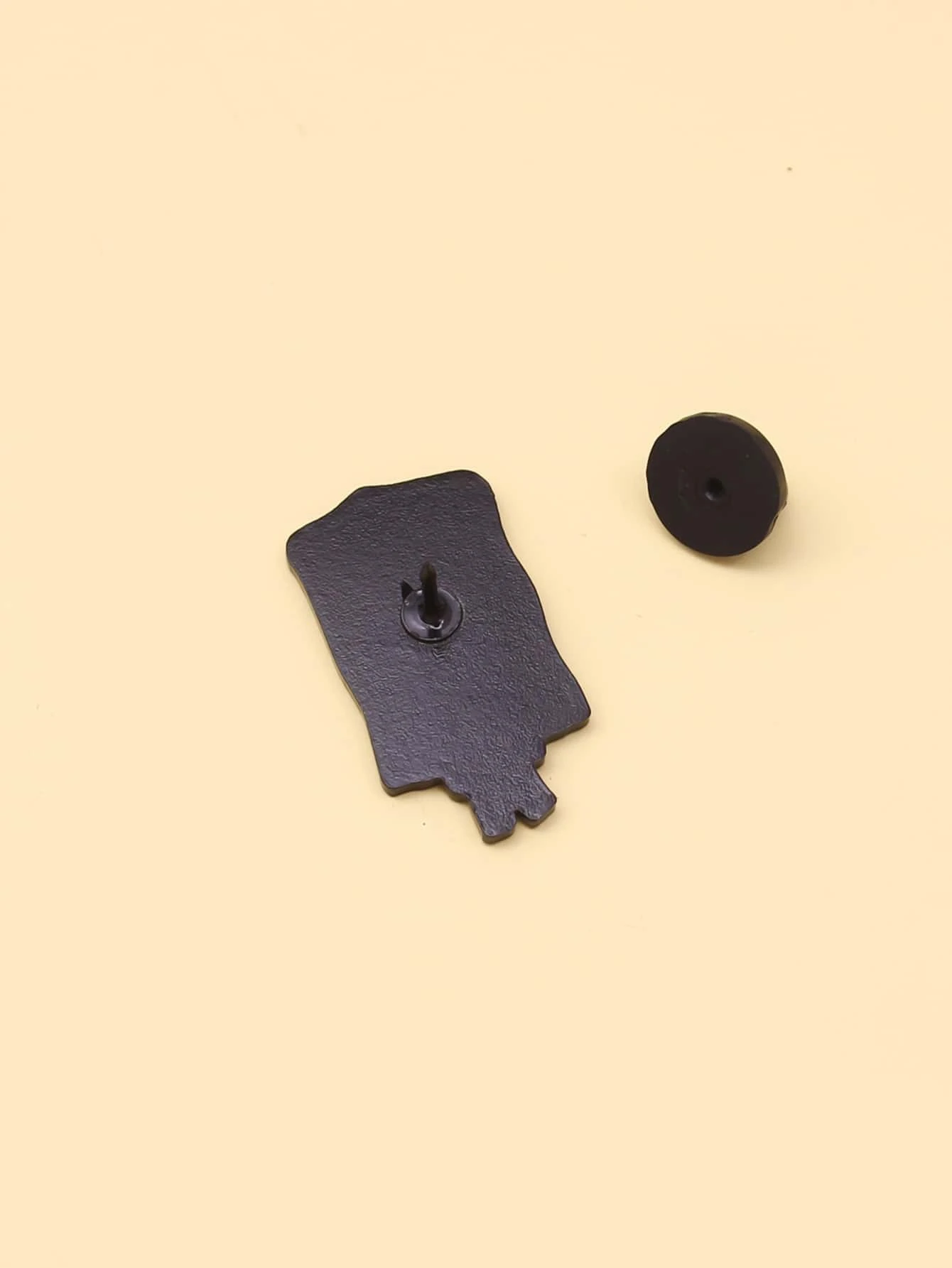 Brooch featuring a combination of heart and letter graphics, creating a charming and personalized accessory with a touch of romantic sentiment.