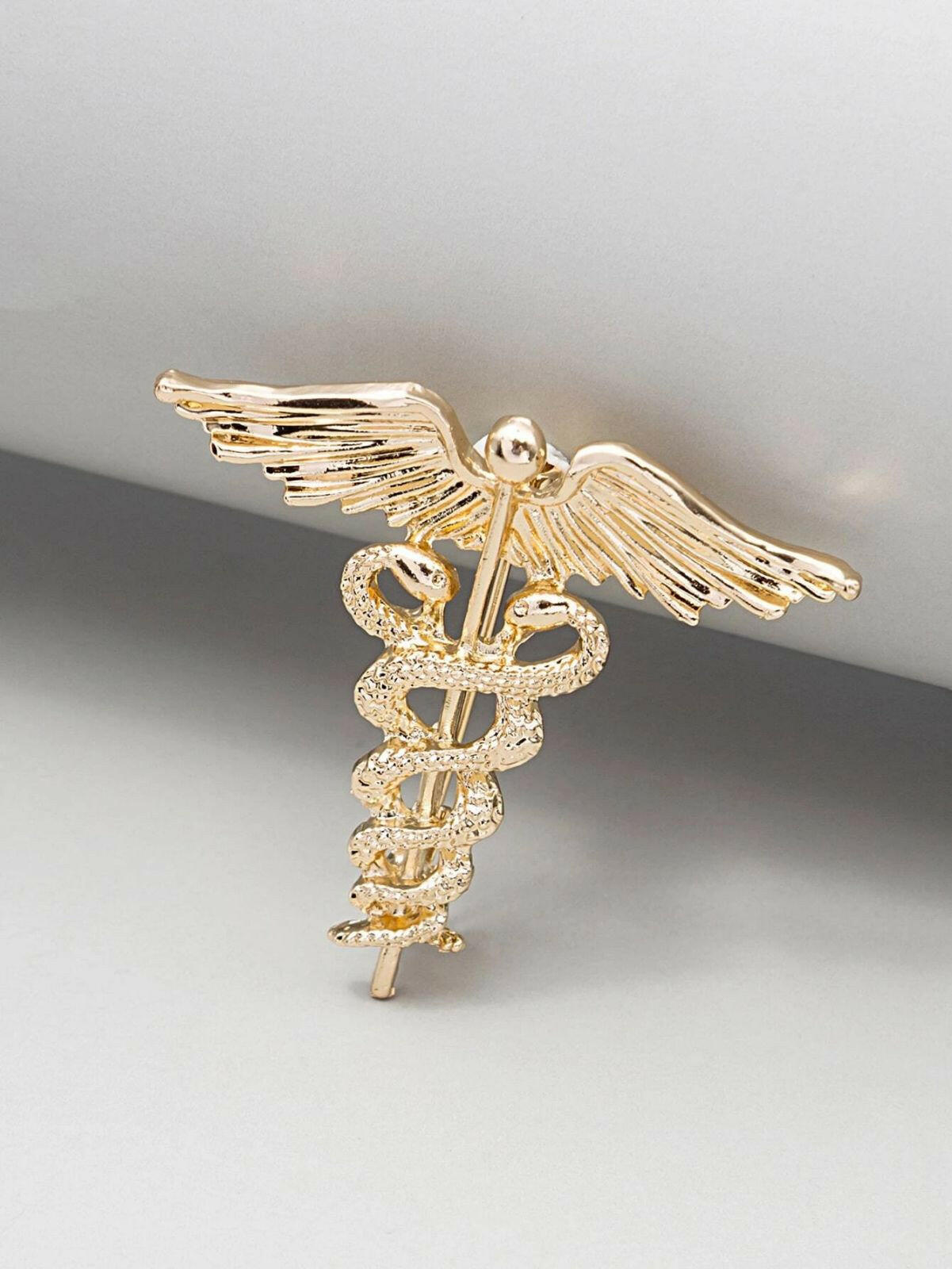 Single creative brooch, showcasing a unique and artistic design for a standout and expressive accessory.