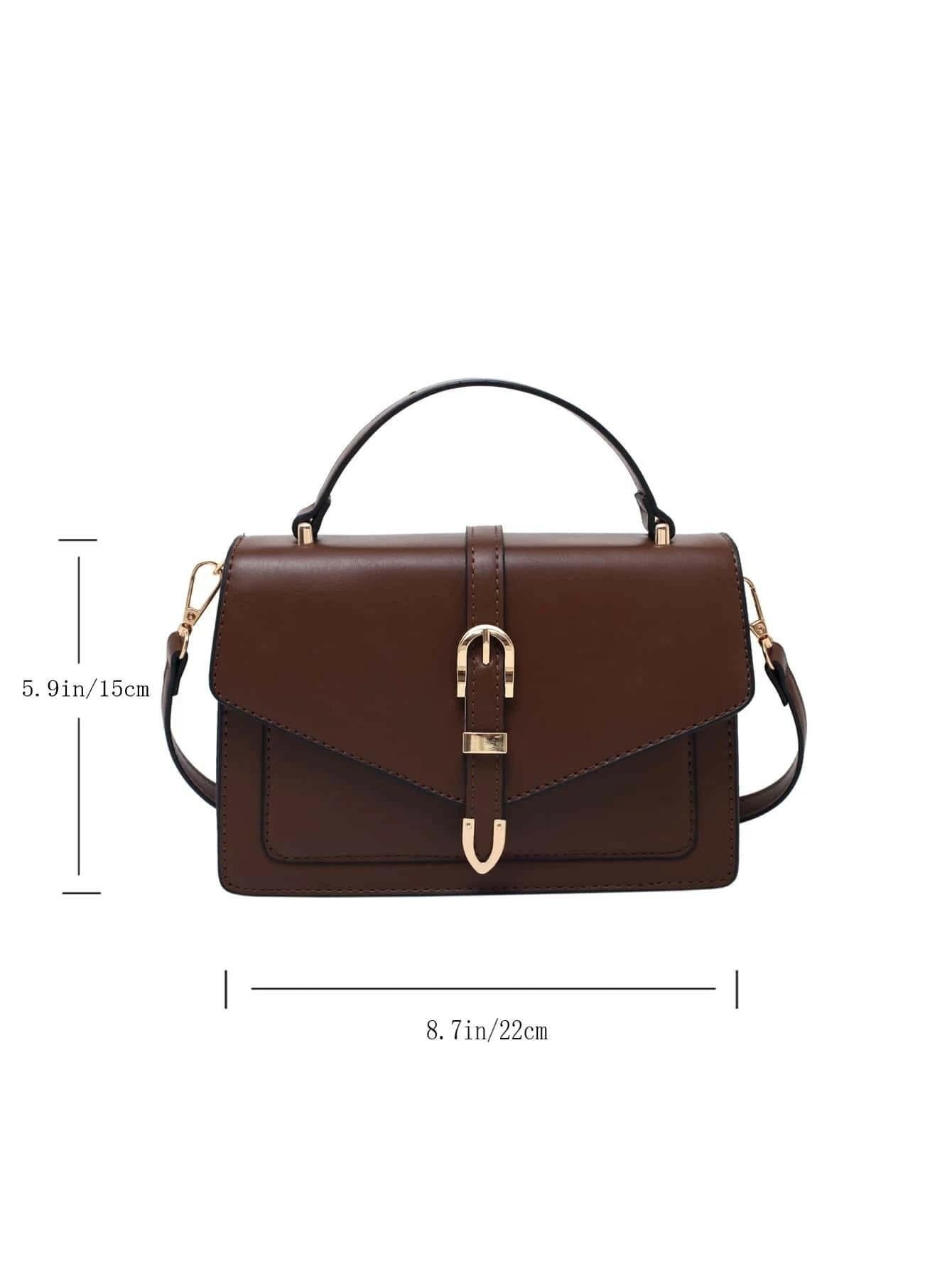Square bag with flap closure and buckle decoration. This stylish accessory blends modern design with classic elements, offering both functionality and a fashionable touch.