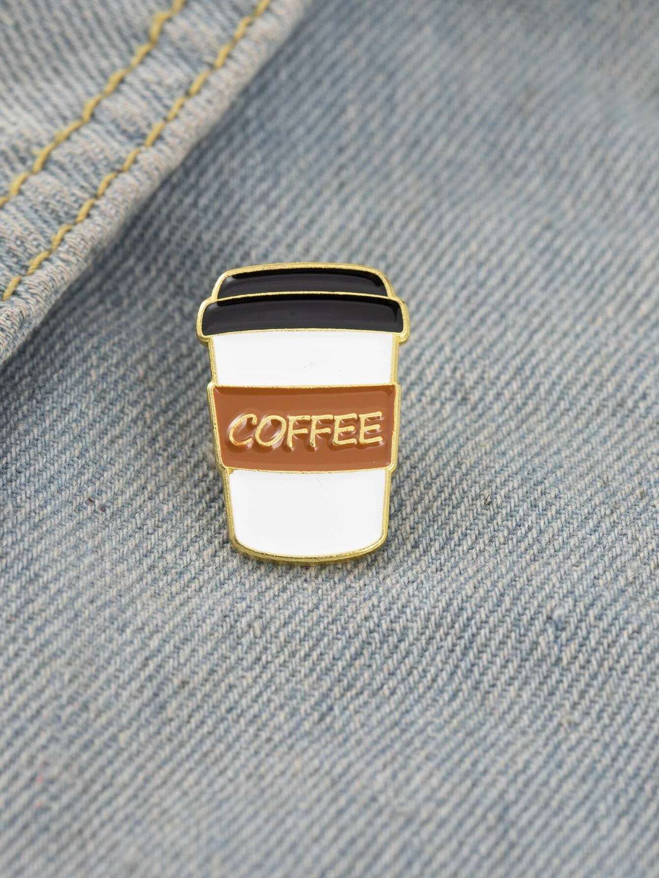 Whimsical coffee design brooch, capturing the essence of everyone's favorite beverage with artistic flair. The brooch features intricate details and playful elements that showcase a coffee cup or beans, making it a charming and delightful accessory for coffee enthusiasts or those who enjoy a touch of caffeinated creativity.