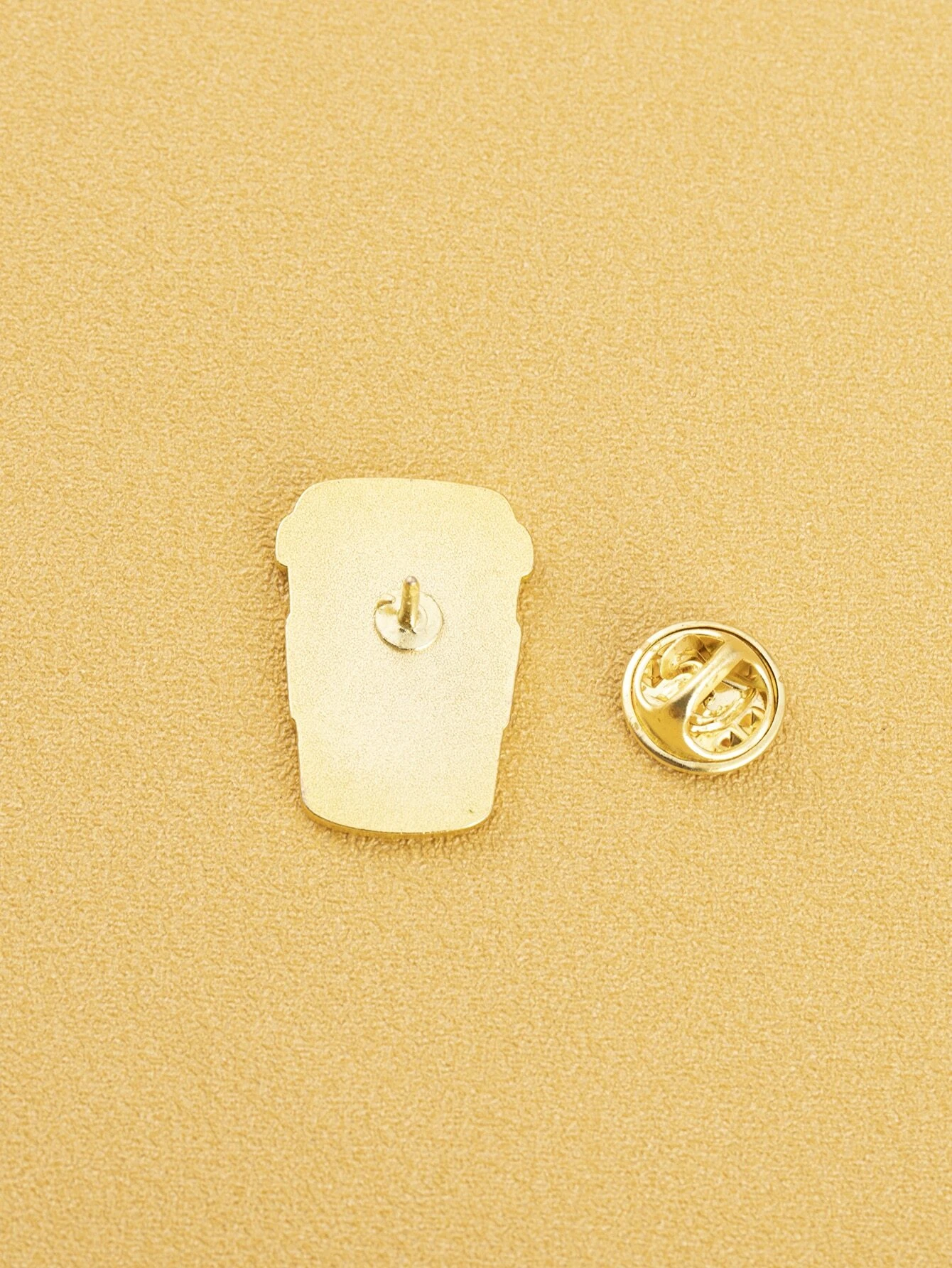 Whimsical coffee design brooch, capturing the essence of everyone's favorite beverage with artistic flair. The brooch features intricate details and playful elements that showcase a coffee cup or beans, making it a charming and delightful accessory for coffee enthusiasts or those who enjoy a touch of caffeinated creativity.