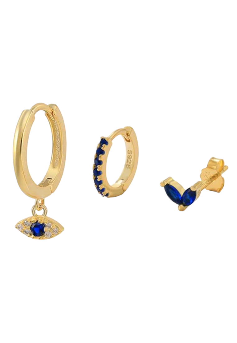 A set of three fashionable silver earrings featuring cubic zirconia and eye decorations. The earrings showcase a combination of sparkling cubic zirconia stones and intricate eye motifs. The silver setting adds a touch of elegance, while the unique design brings a mix of glamour and symbolism to these versatile accessories.