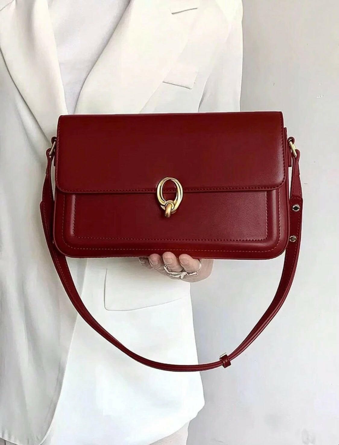 Simple and stylish, this Solid Color Simple Design Shoulder Bag is a chic pick for your everyday errands. Crafted from premium material, this bag is designed to last and is perfect for carrying all your essentials in a sophisticated style.