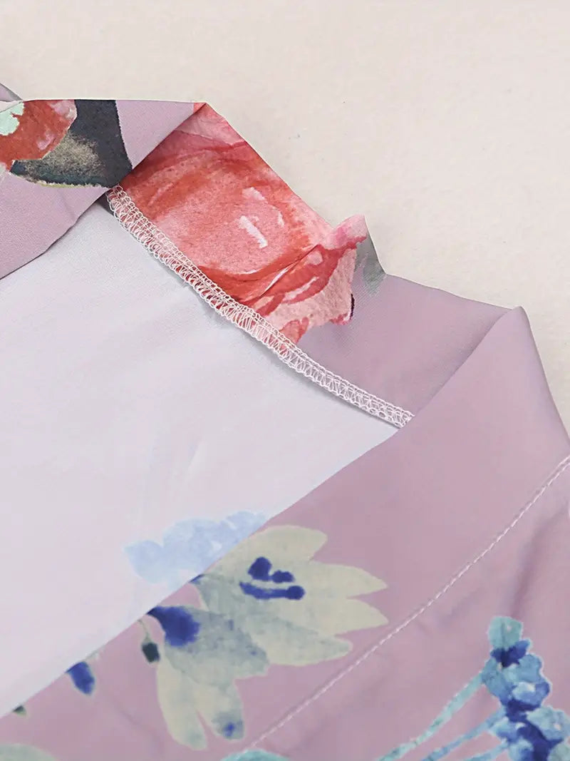 Add some flair to your beach vacation with our Floral Peacock Print Cover Up Kimono. Made with a vibrant and stylish floral peacock print, this cover up will ensure you stand out while providing coverage from the sun. Perfect for a day of lounging by the pool or a stroll on the beach.