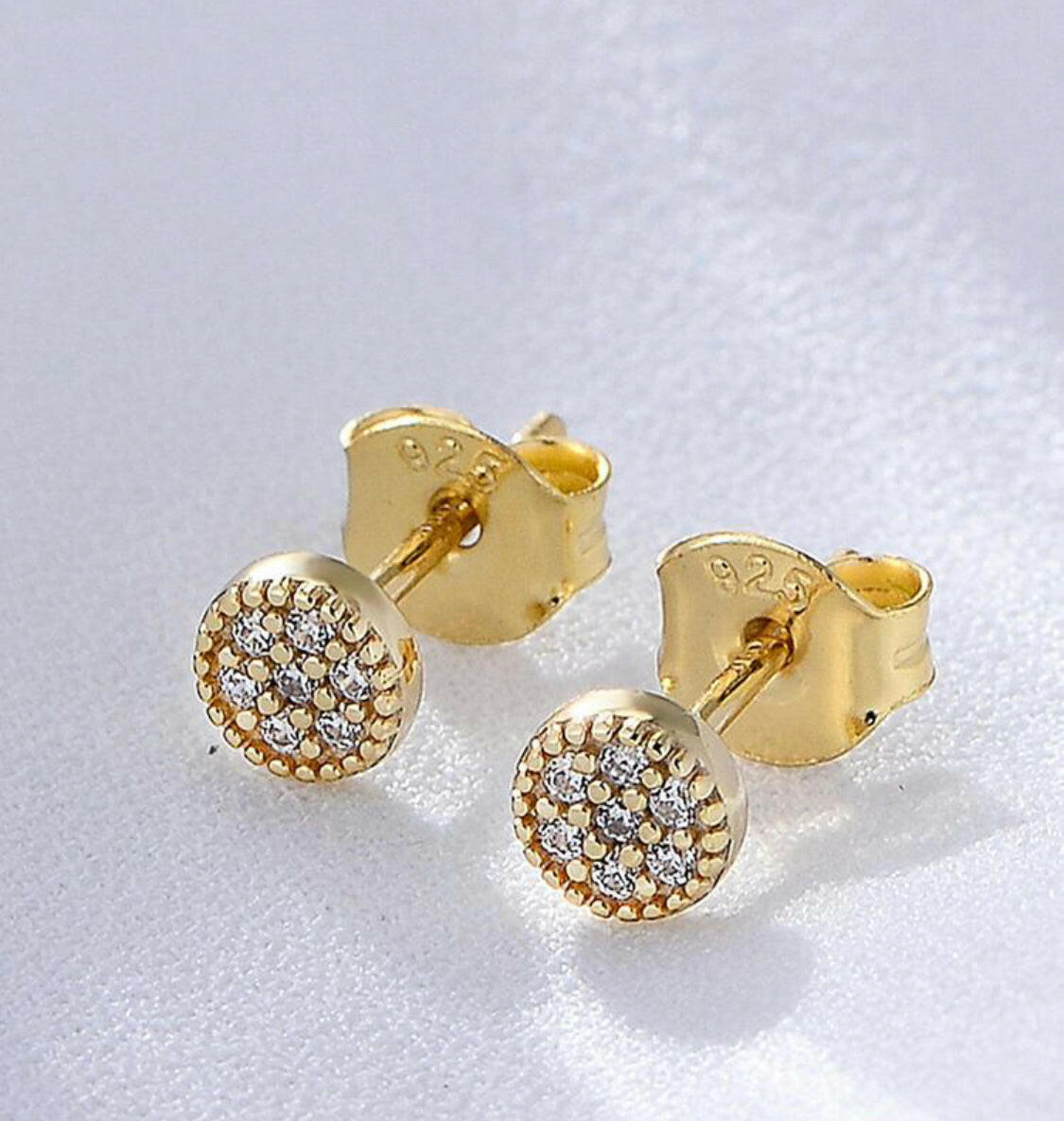 These classic cubic zirconia round decor sterling silver stud earrings are the perfect accessory for any outfit. Carefully crafted with 925 sterling silver, these earrings boast an eye-catching sparkle and shine. Studs are a timeless style that look beautiful for any occasion.
