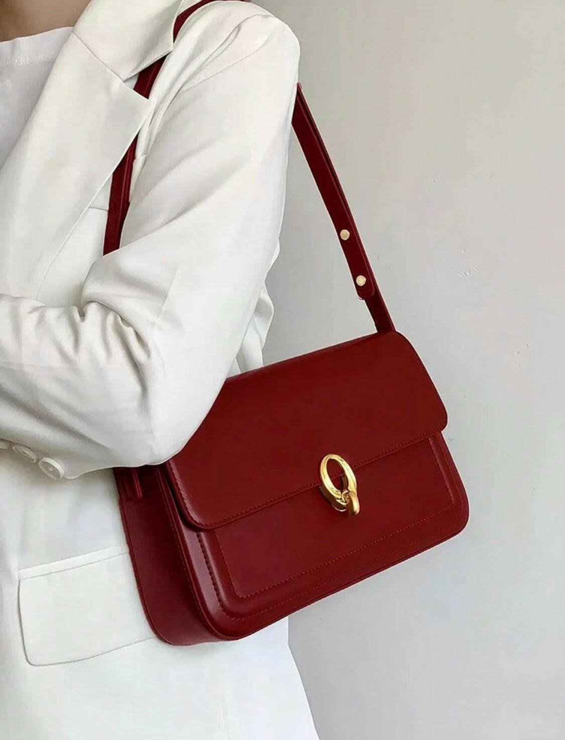 Simple and stylish, this Solid Color Simple Design Shoulder Bag is a chic pick for your everyday errands. Crafted from premium material, this bag is designed to last and is perfect for carrying all your essentials in a sophisticated style.