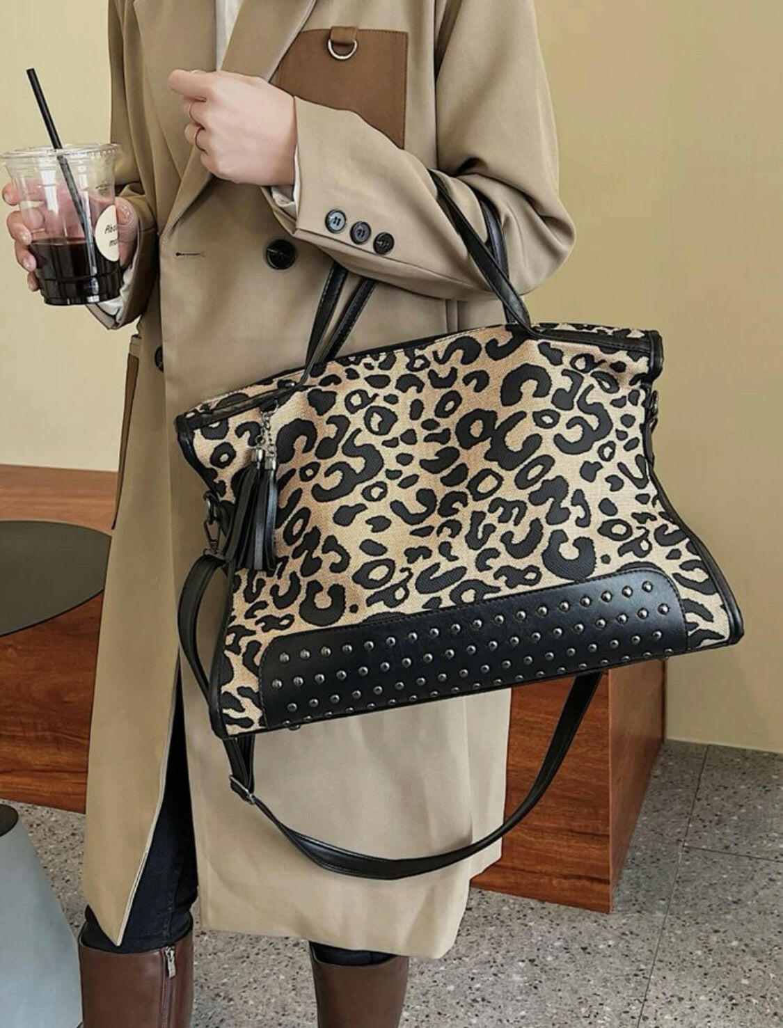 This Leopard Studded Decor Shoulder Tote Bag provides a fashionable way to keep your essentials close at hand. The stylish design features a stylish leopard pattern and studded details that adds a unique touch of style. The spacious interior offers enough space to store all of your necessities, while the sturdy construction ensures lasting durability.