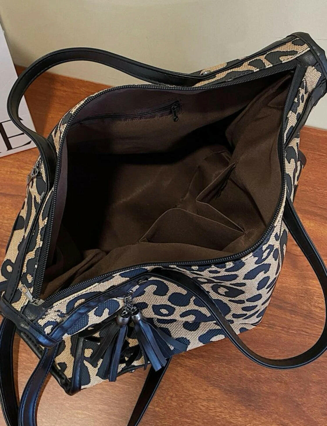 This Leopard Studded Decor Shoulder Tote Bag provides a fashionable way to keep your essentials close at hand. The stylish design features a stylish leopard pattern and studded details that adds a unique touch of style. The spacious interior offers enough space to store all of your necessities, while the sturdy construction ensures lasting durability.