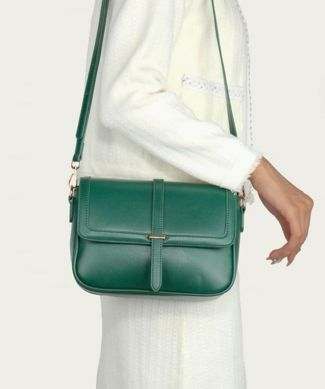 This eye-catching Green Metal Detail Flap Square Bag features a chic metallic trim and a contemporary square silhouette, making it the perfect addition to any wardrobe. The spacious interior is ideal for storing everyday items, and the hardware detail adds an edgy finishing touch.