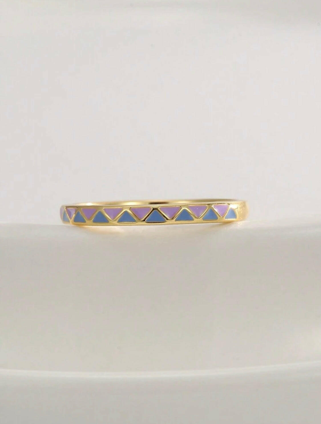 This Grid Pattern and Enamel Decor Ring features a unique design that combines an elegant grid pattern with a bright and colorful enamel finish. Its lightweight and comfortable wearability make it perfect for everyday wear.