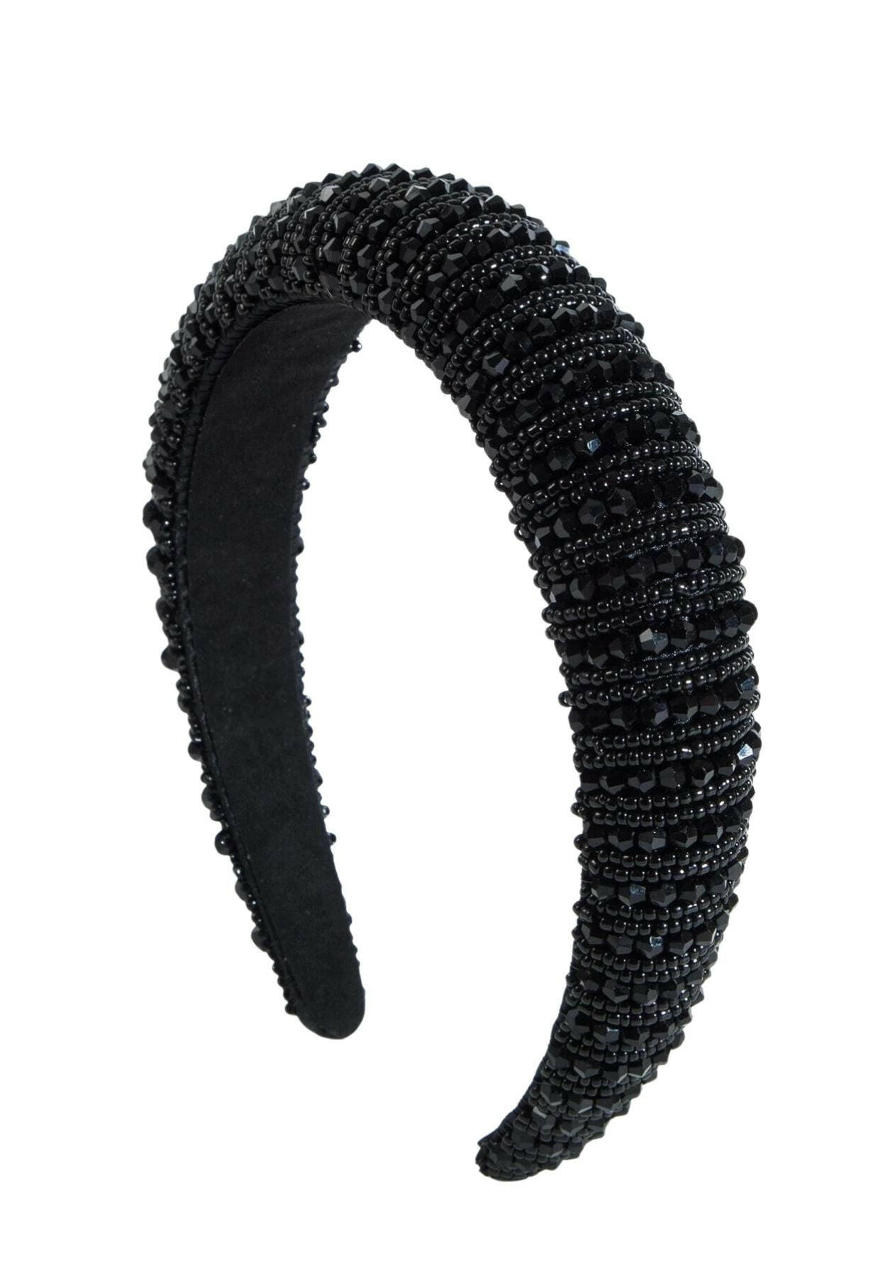 A luxurious-style headband in black, adorned with crystal bead decorations, adding a touch of elegance and glamour to your hair accessory collection.