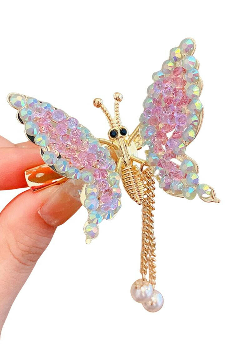 An alligator hair clip adorned with butterfly decorations and faux pearl charms, creating a fashionable and charming accessory for your hair.