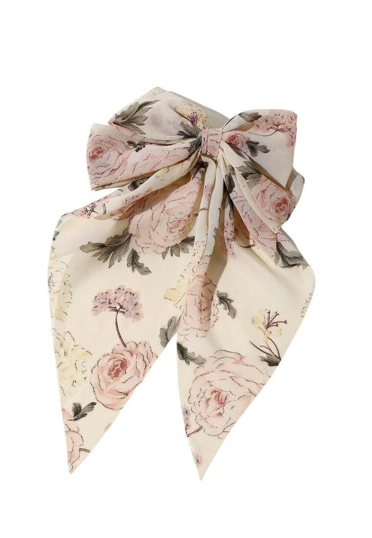 Hair clip with a bow and flower print decor, blending playful charm with floral motifs for a delightful accessory.