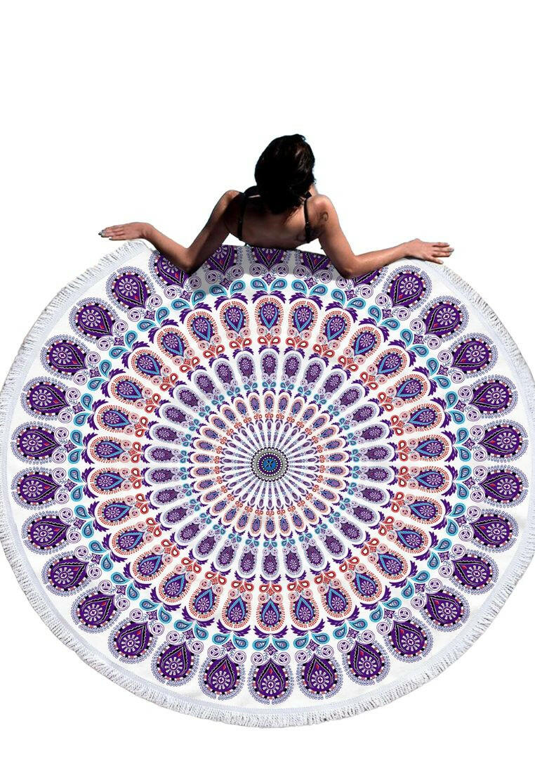 A beach towel featuring a purple mandala pattern and fringe trim. The towel showcases an intricate mandala design in shades of purple, with decorative fringe trim along the edges. This towel is both stylish and functional, perfect for beach outings or outdoor relaxation. The purple mandala pattern and fringe trim add a touch of bohemian elegance to the towel.