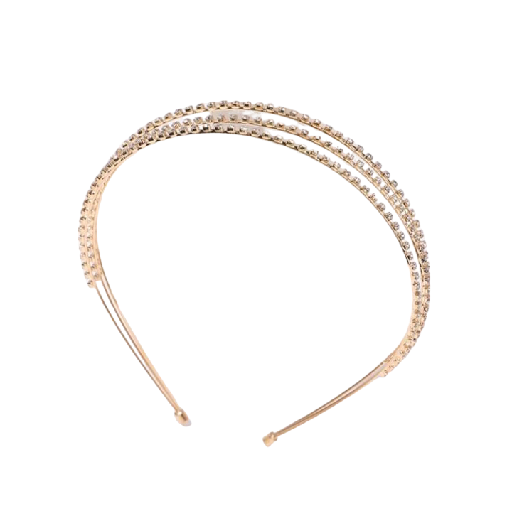 A fashion headband adorned with solid rhinestone decorations, creating a glamorous and stylish accessory that adds a touch of sparkle and sophistication to any hairstyle.