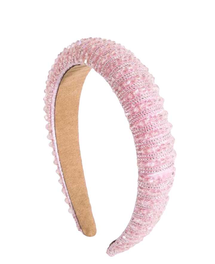 An opulent and elegant pink crystal decorative headband, designed with luxury style in mind. The headband features intricate crystal embellishments in various shades of pink, creating a stunning and glamorous accessory for any occasion.