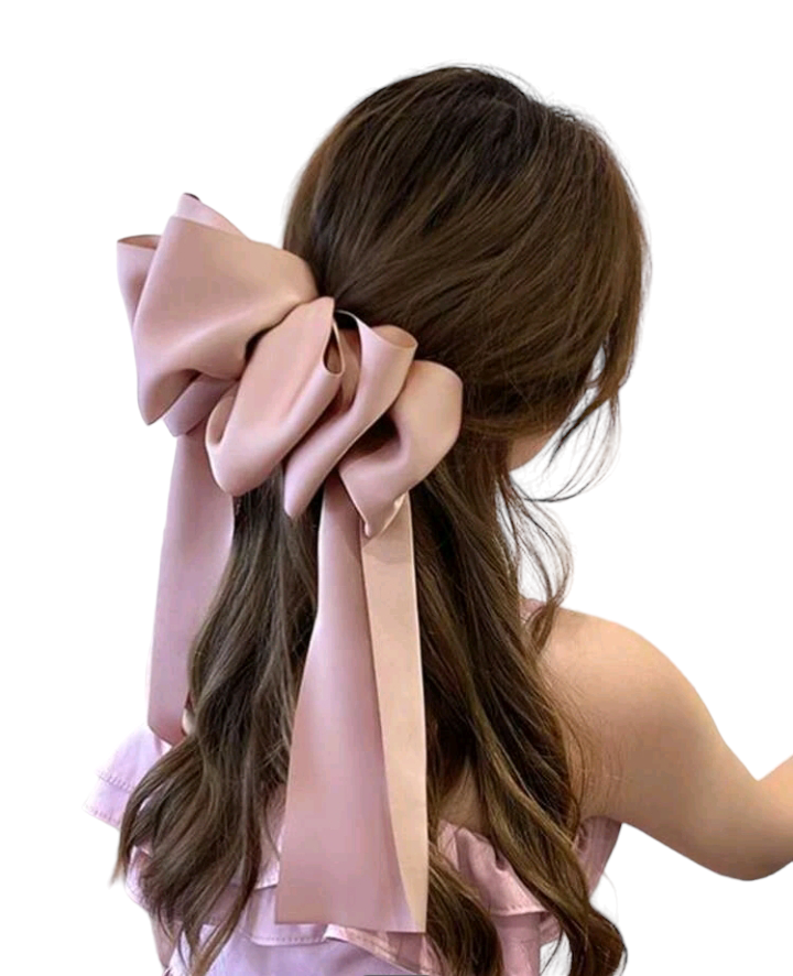 A lovely pink bow decorated hair clip, adding a touch of sweetness and elegance to your hairstyle. This chic accessory is perfect for enhancing your look with a charming and stylish detail.