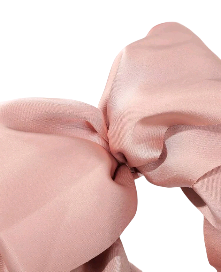 A lovely pink bow decorated hair clip, adding a touch of sweetness and elegance to your hairstyle. This chic accessory is perfect for enhancing your look with a charming and stylish detail.