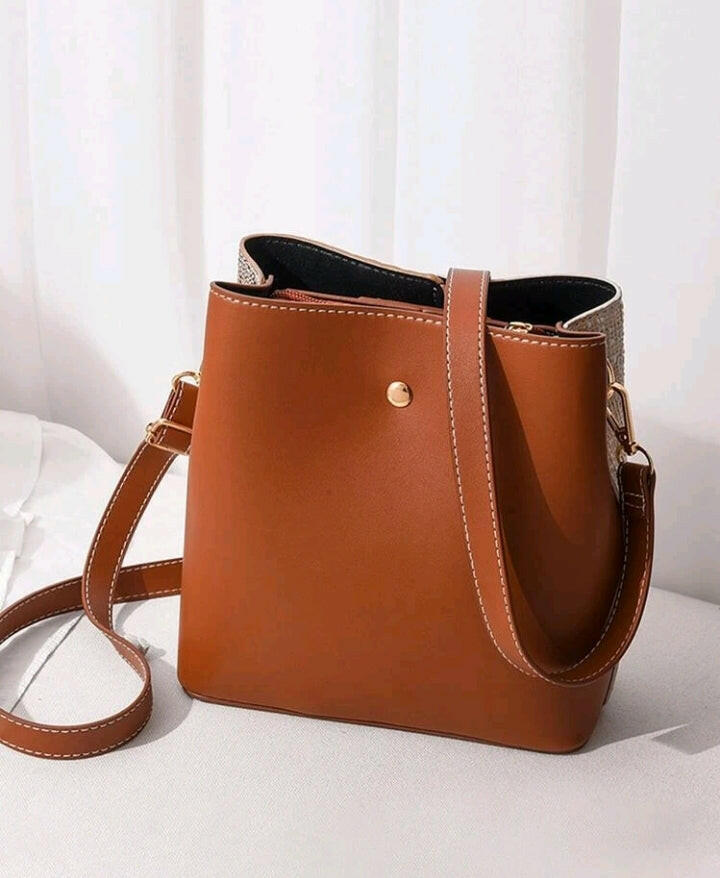 This stylish Color Block Bucket Bag elevates your everyday look with its eye-catching color-block design. Crafted from premium materials, this bag is designed to last and the adjustable shoulder strap ensures maximum comfort. Perfect for daily errands, work and even weekend getaways!