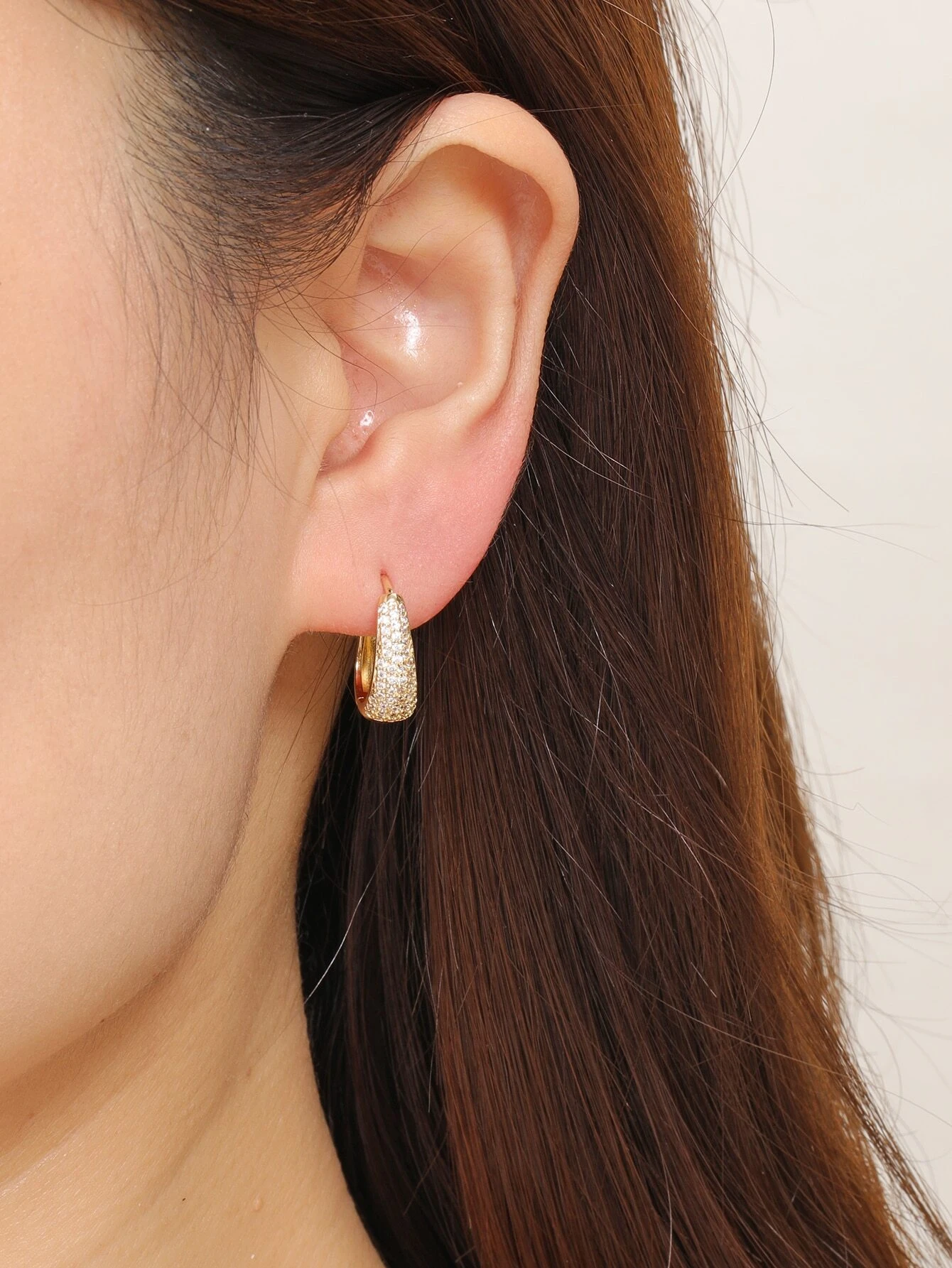 Rhinestone-studded hoop earrings, adding a touch of elegance and glamour.