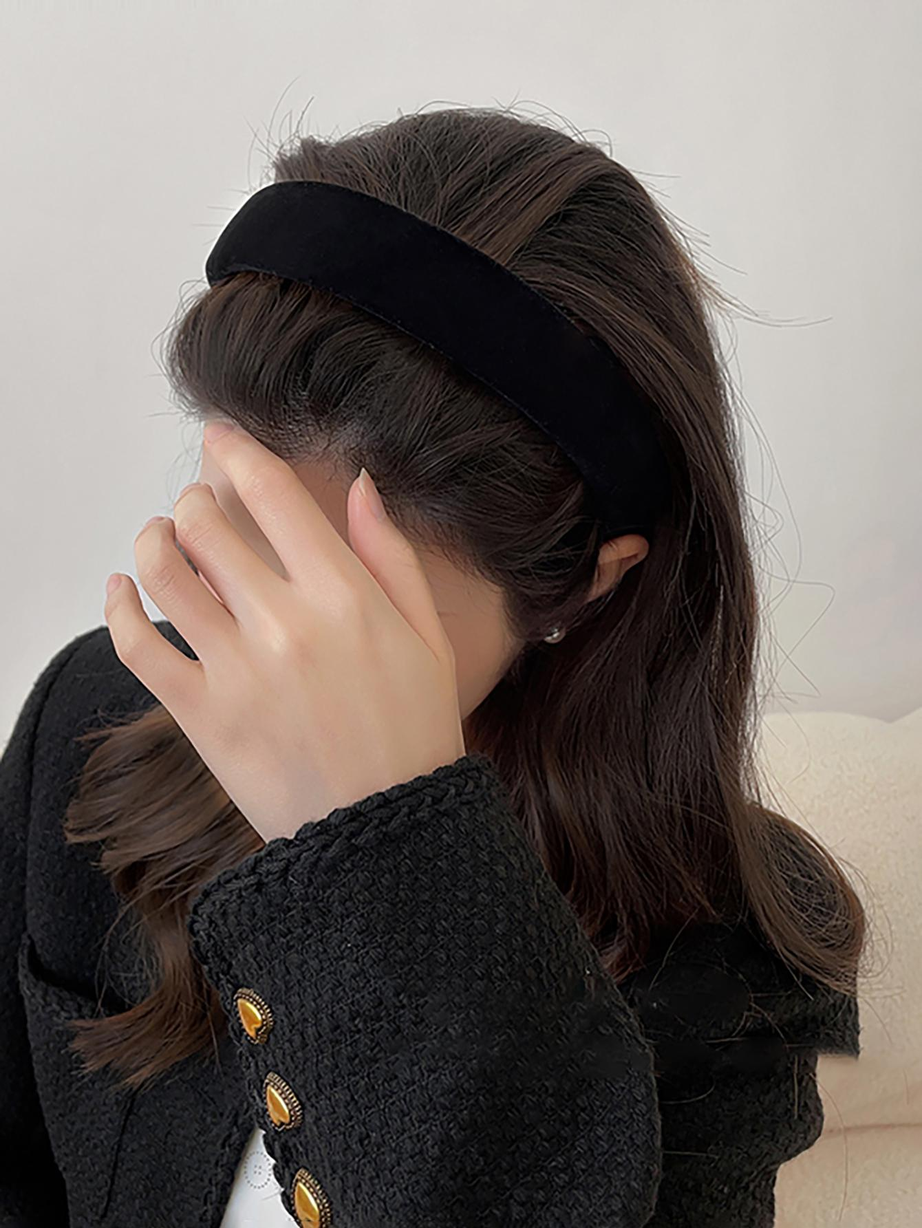 A high crown sponge headband in black velvet, providing a stylish and comfortable accessory to elevate your hair look.