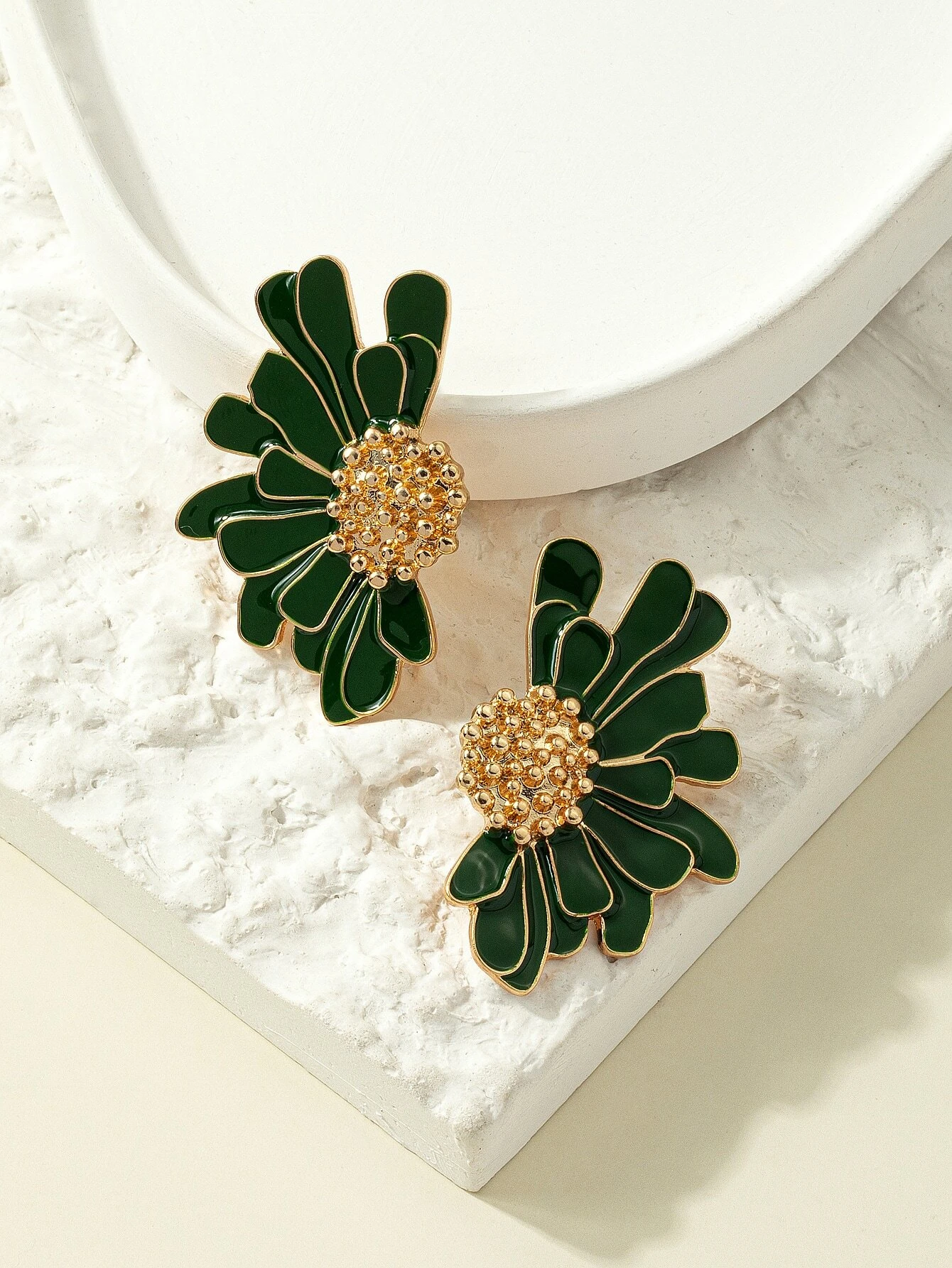 Green flower design stud earrings, featuring delicate floral patterns in a stylish and understated stud format.