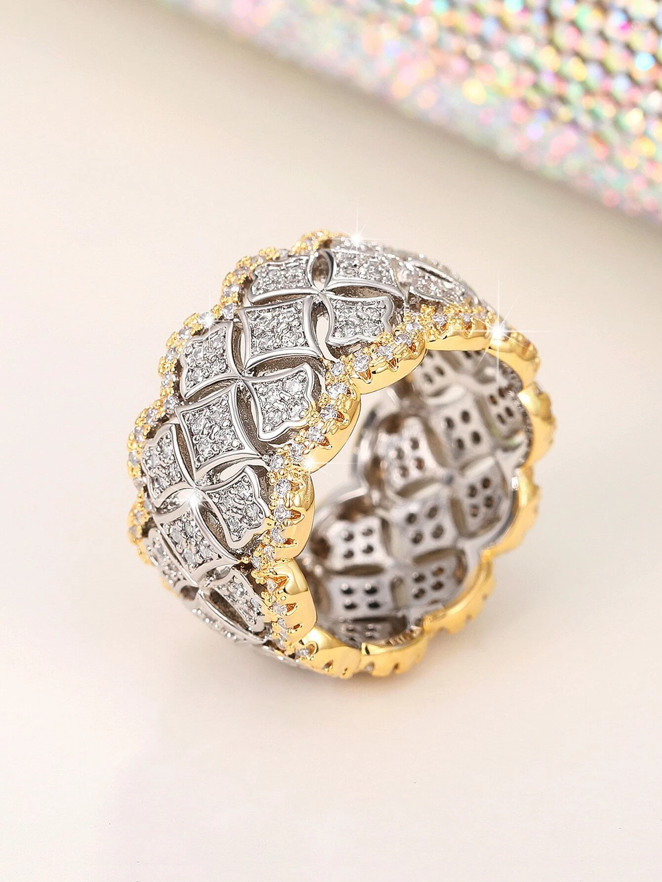 A stunning cubic zirconia decor ring with intricate details. The ring showcases a brilliant cubic zirconia gemstone set in an elegantly designed setting. The shimmering gemstone creates a captivating and glamorous look. This ring is a stylish and sophisticated accessory that adds a touch of elegance and luxury to any outfit.